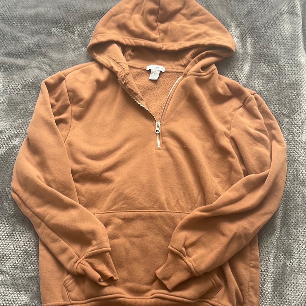 Terracota colored half zip up sweatshirt